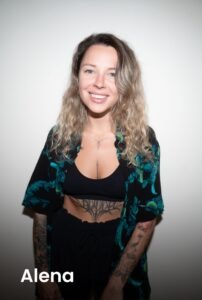 Smiling portrait of tattoo artist Alena
