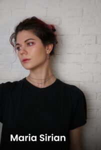 A professional portrait of tattoo artist Maria Sirian at Names Tattoo Studio in Lisbon