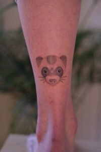 Fine line celestial hand tattoo featuring stars, crescent moon, and dainty dots