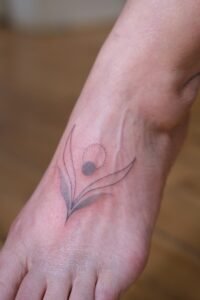 Nessi eyes arm tattoo