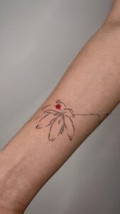 Nessi eyes arm tattoo