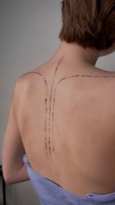 Nessi eyes arm tattoo