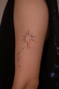 Red Japanese Kanji characters with black geometric patterns tattoo