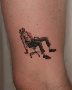 Micro-realism skeleton tattoo in a business suit with a red tie slumped in an office chair, fine line detail on arm