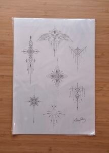 A minimalist tattoo flash sheet featuring sacred geometry and celestial designs