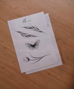 Elegant minimalist tattoo flash sheet featuring fine-line butterfly
