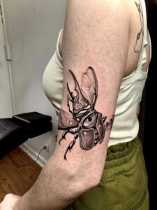 Fine line celestial hand tattoo featuring stars, crescent moon, and dainty dots