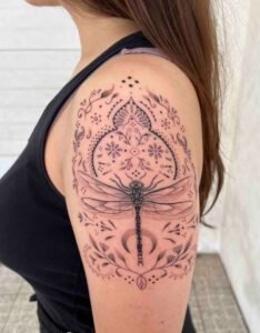 Nessi eyes arm tattoo