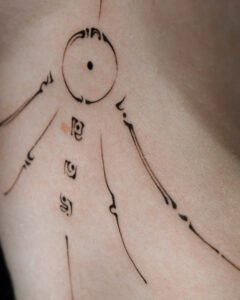 Micro color realism Monstera leaf tattoo with green and red variegation on inner forearm