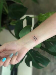 Nessi eyes arm tattoo